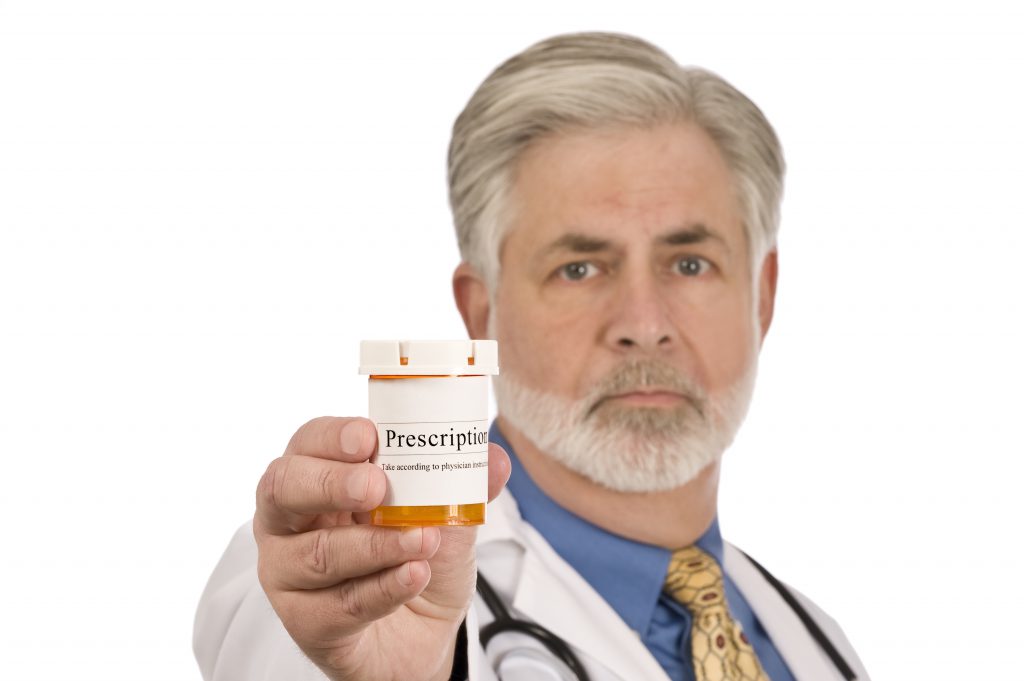 Doctor holding a prescription bottle