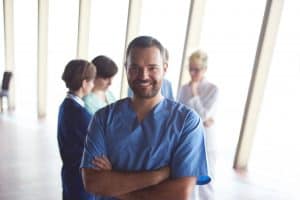 Doctor standing with arms crossed