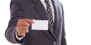 Person showing blank business card