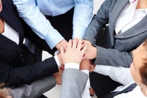 Business people with stacked hands