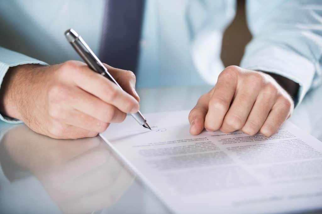Person signing a form