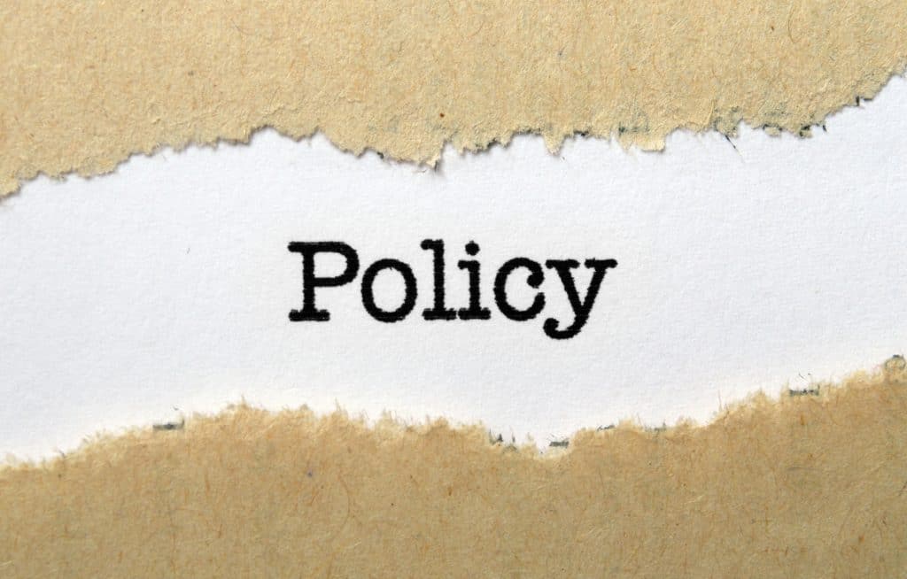 Policy typed on a piece of paper