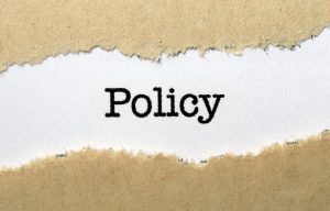 Policy typed on a piece of paper