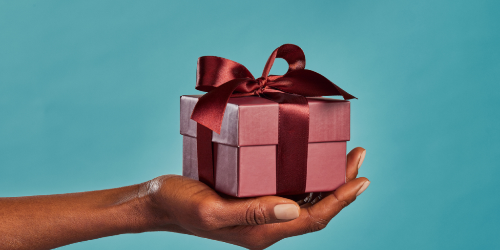Person holding out a gift