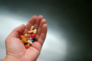 Hand holding pills