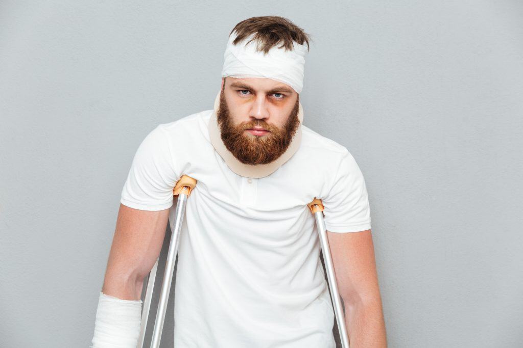 Injured person using crutches