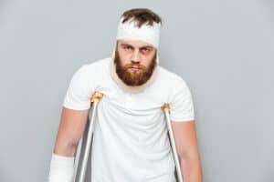 Injured person using crutches