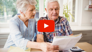 Older couple reviewing medical bills