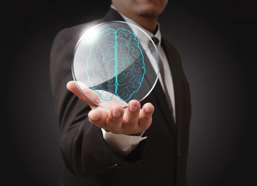 Person holding an image of a brain