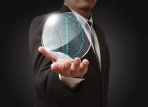 Person holding an image of a brain