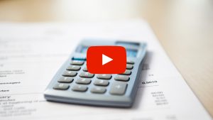 Calculator laying on documents