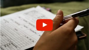 Person filling out a form