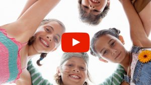 Kids standing in a huddle