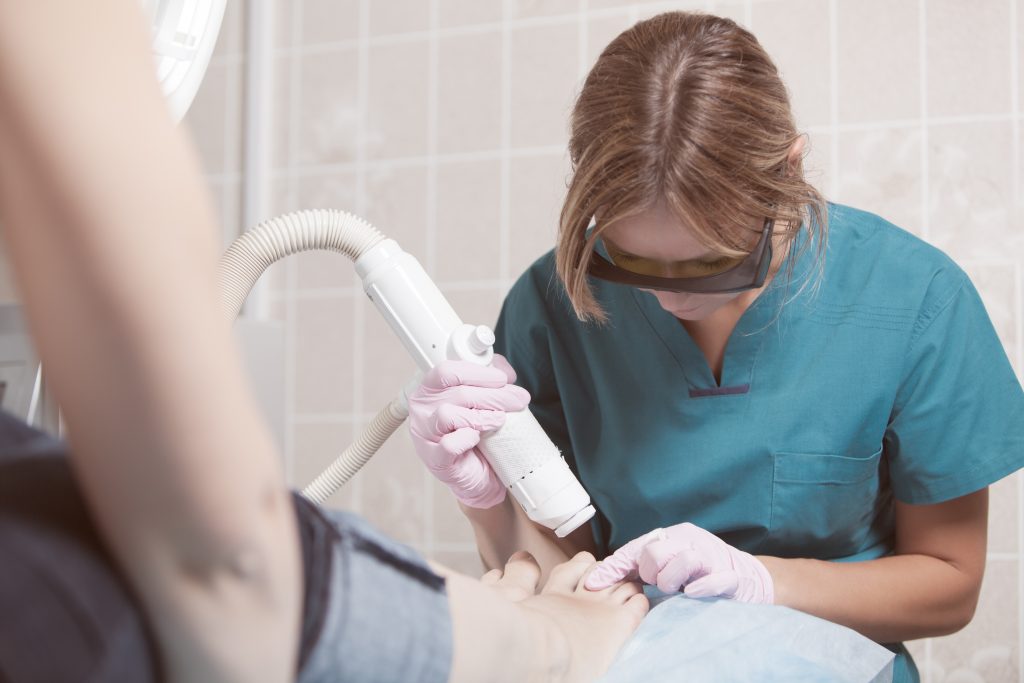Doctor using a laser