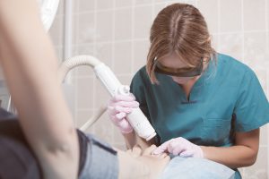 Doctor using a laser