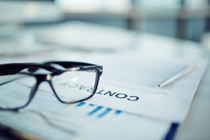 Glasses laying on a contract