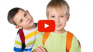 Two kids wearing backpacks