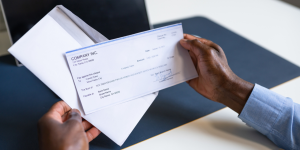 person holding a check