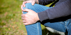 Person rubbing their knee
