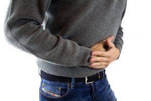 Person holding their stomach