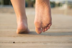 Person walking barefoot