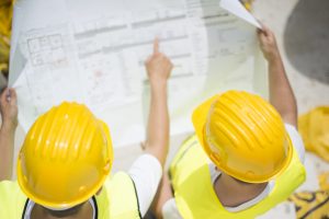 Construction workers reviewing plans