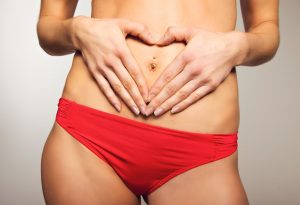 Person with hands on stomach