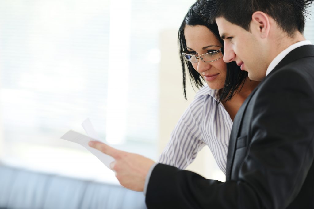 People reviewing documents