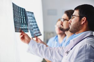 Doctors reviewing radiographic images