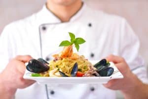 Person holding plate of healthy food