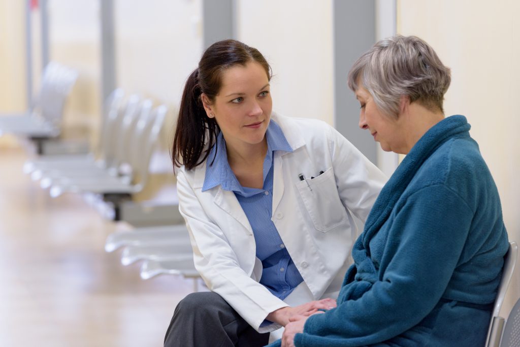 Doctor talking with patient