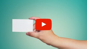 Person holding a blank business card