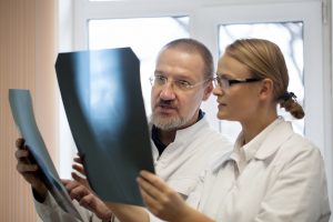 Doctors reviewing radiographic images
