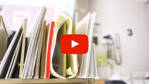 Image of papers in a desk organizer