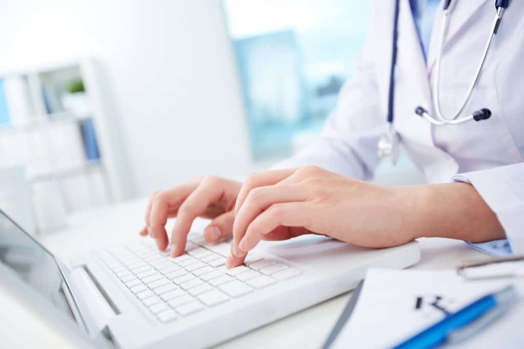 Doctor using laptop