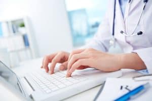 Doctor using laptop