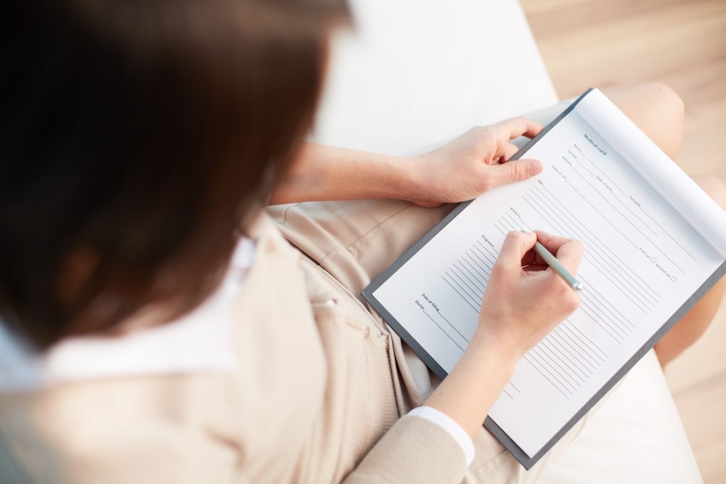 Person filling out a form