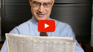 Person reading a newspaper