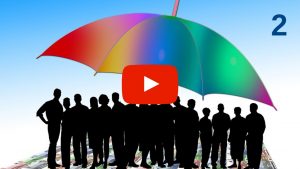 Crowd of people standing under a large umbrella