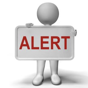 Figure holding an "alert" sign