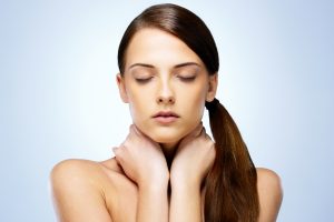 Person rubbing neck