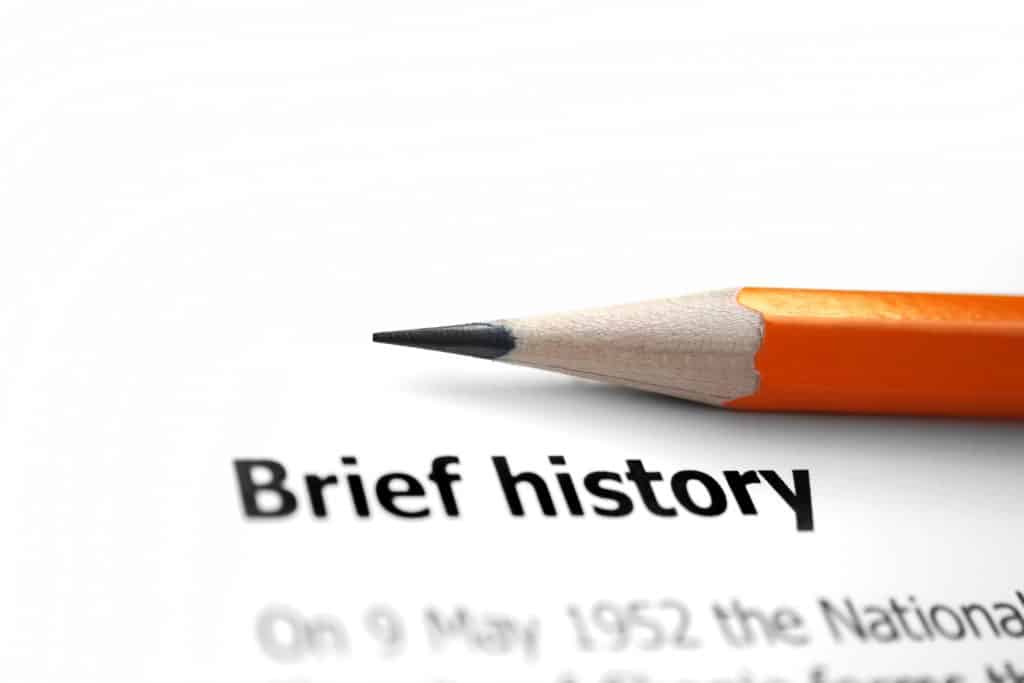 Pencil sitting on paper with title " Brief history"