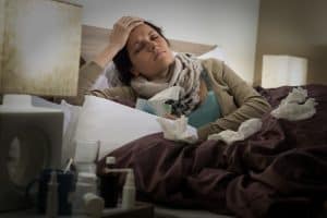 Sick person laying in bed