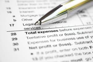 Expense form with an ink pen on top