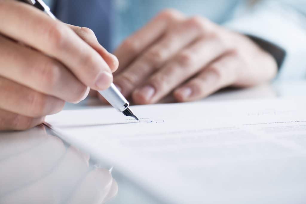 Person filling out a form