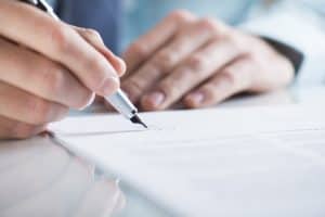 Person filling out a form