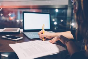 Person filling out a form