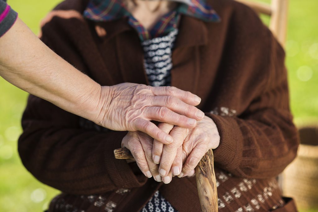 Older couple holding hands