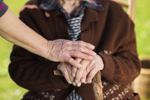 Older couple holding hands