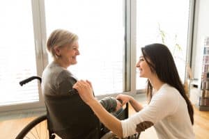 One person talking to another in a wheelchair